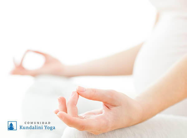 Pregnant woman sitting and meditating